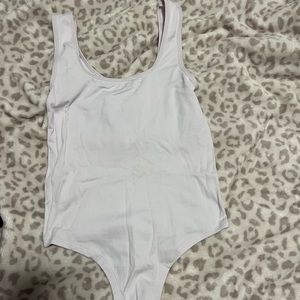 Light pink body suit thong.
